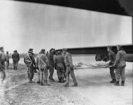 Asisbiz USAAF 8AF 401BG Medical personnel carry an dead airmen from a B 17 after Chateauroux raid 10 Mar 1944 FRE1709