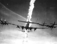 Asisbiz Boeing B 17G Fortresses 8AF 486BG drop their loads of anti personnel bombs over the DZ FRE8497