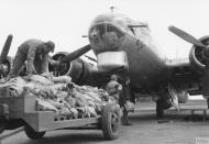 Asisbiz 43 38285 B 17G Fortress 8AF 493BG860BS NGH Bomb Bay of Blues loading food supplies 7th Apr 1945 FRE2152