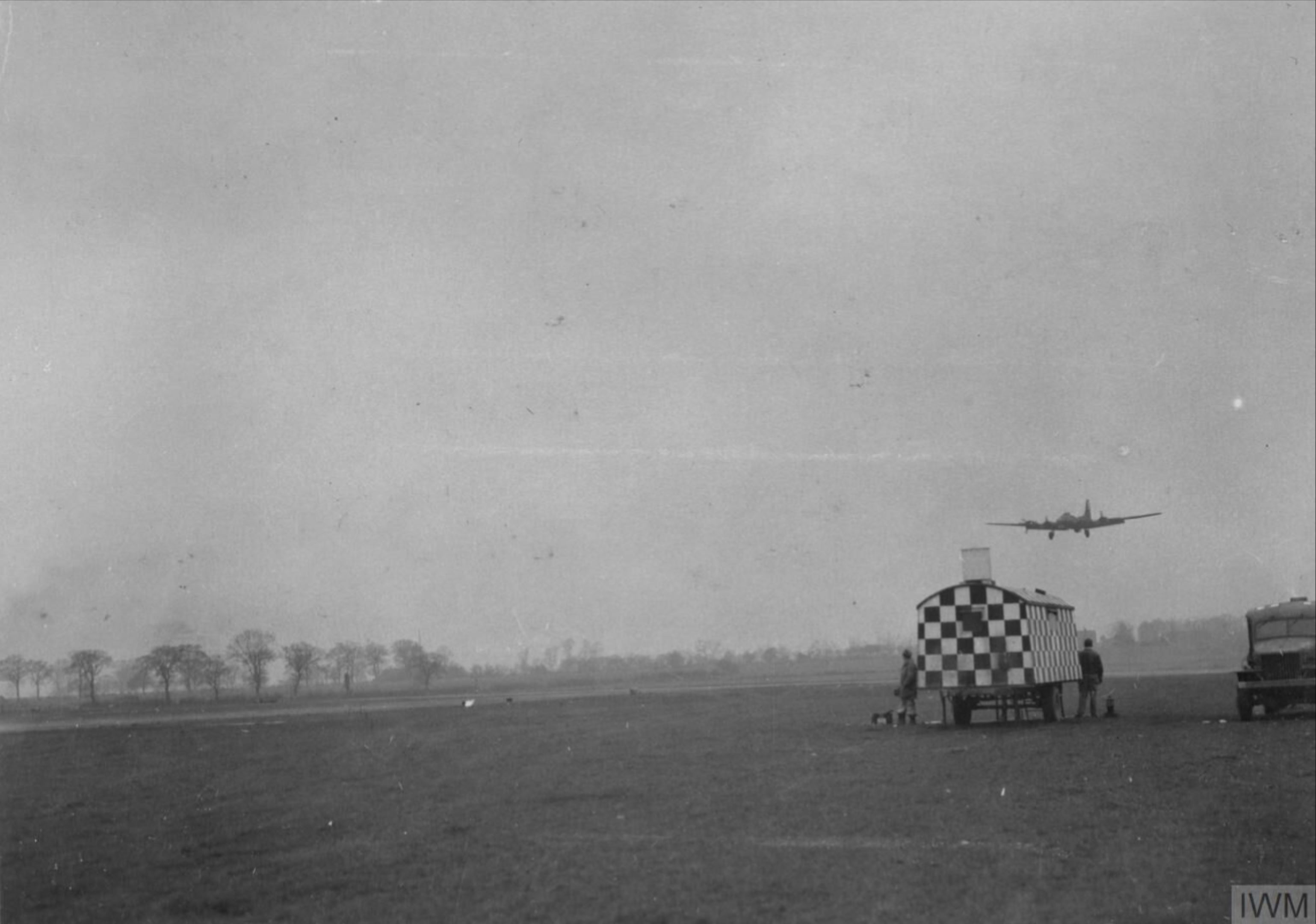Boeing B 17F Fortress 8AF 94BG lands in low visibility at Rougham guided by flares and the mobile tower 13 Dec 1943 FRE3822