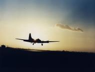 Asisbiz 8th Air Force Boeing B-17 Fortress comes into land just on last light 01
