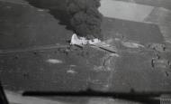 Asisbiz Boeing B 17 Fortress lies burning after belly landing after a raid on Orman airfields 1944 IWM FRE14224