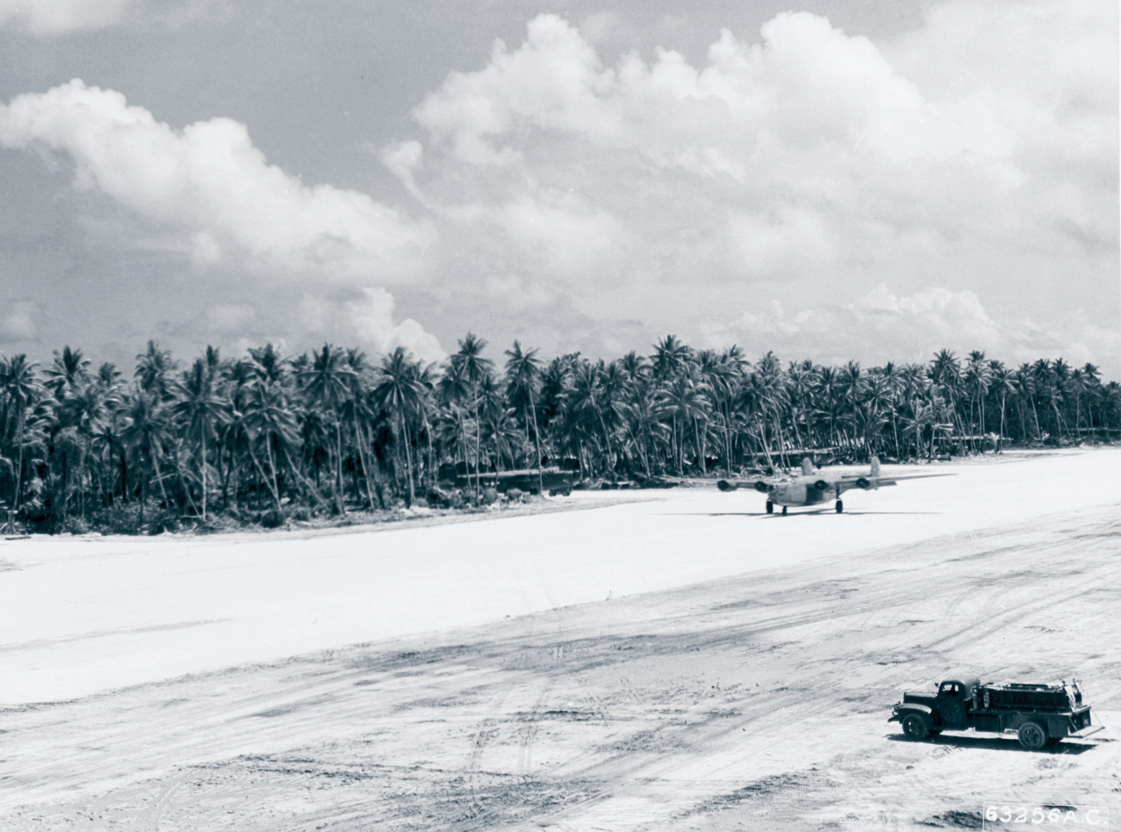 7AF B-24 Liberator lands at Nanumea Island Ellice Isls 14th Dec 1943 NA611