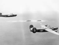 Asisbiz 42-109947 B-24J Liberator 7AF 11BG26BS returning to their base showing replaced left wing and right rudder 02
