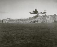 Asisbiz Consolidated B-24 Liberator 7AF 11BG98BS flying low level over Chichi Jima Is Bonin Isls 28th Dec 1944 01
