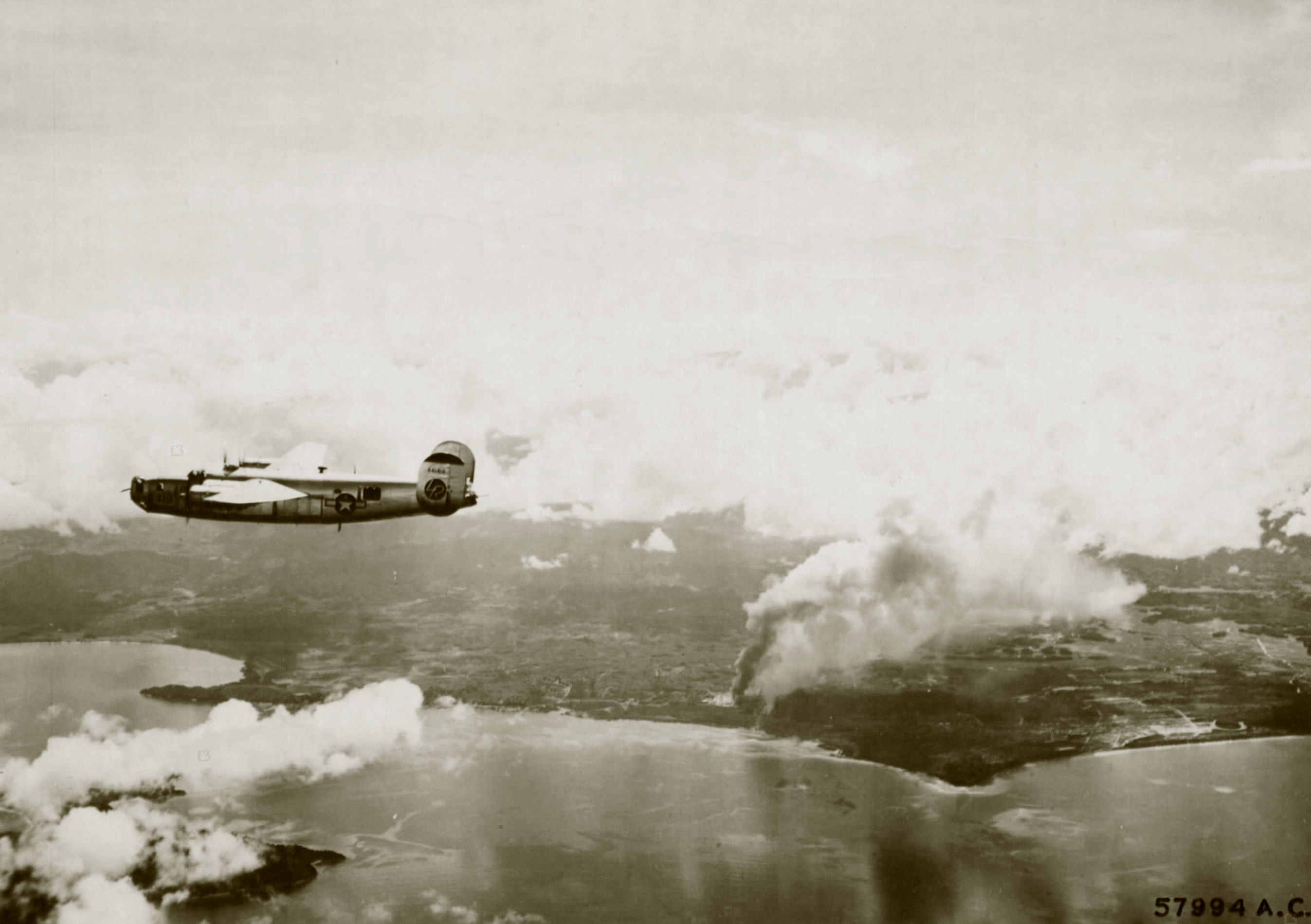 44-41419 B-24L Liberator 13AF 307BG370BS over Borneo after hitting the Jesselton airfield 13th Mar 1945 01