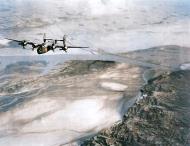 Asisbiz Consolidated B-24's 14AF 308BG over China’s Old Yellow River Bridge 1945