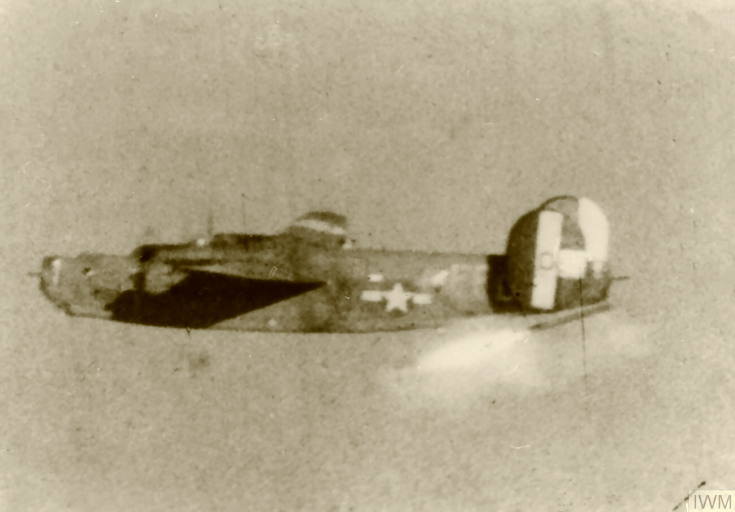 42-50290 B-24H Liberator 8AF 389BG565BS EED in flight launches a rocket from beneath its tail FRE1550