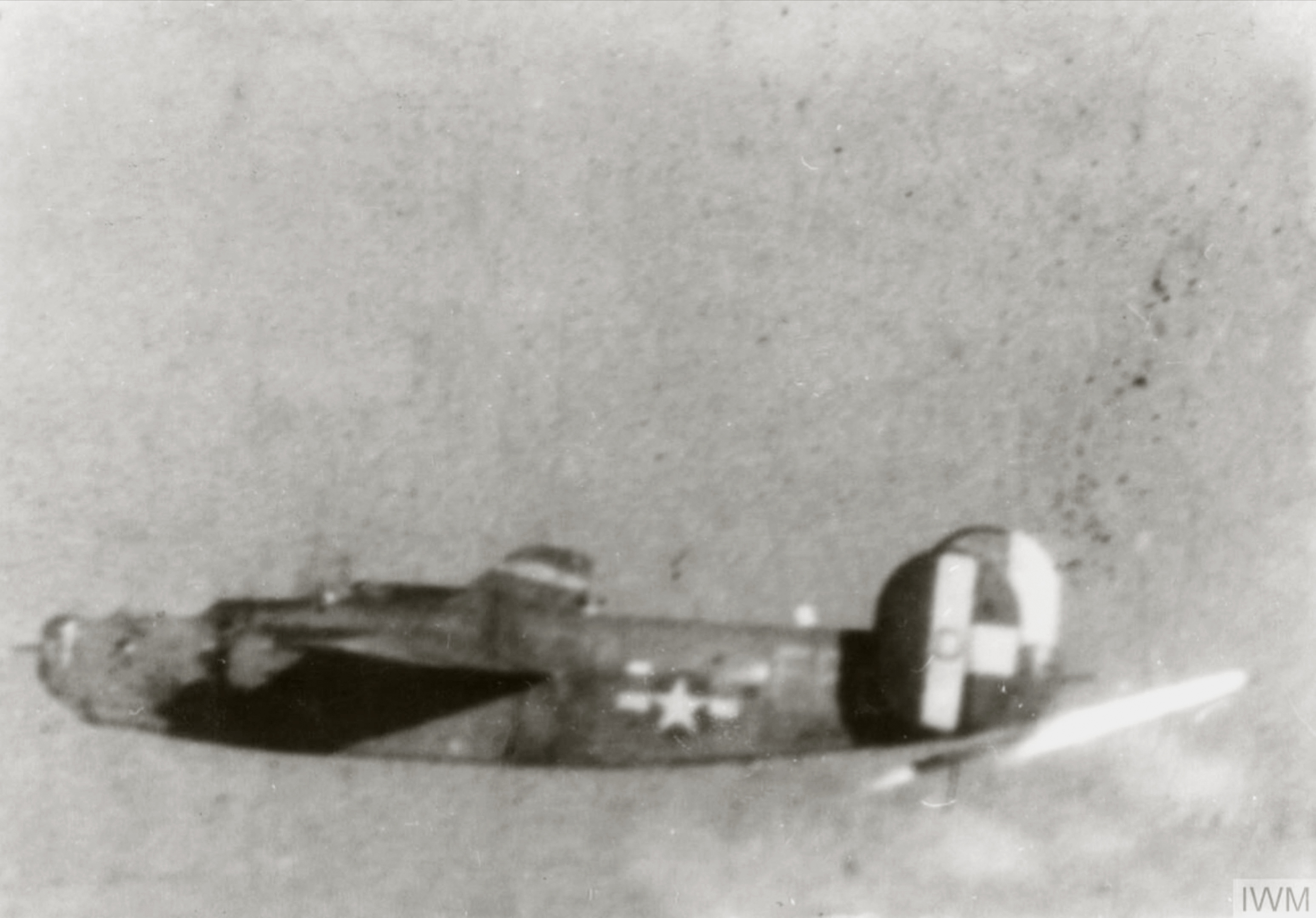 42-50290 B-24H Liberator 8AF 389BG565BS EED in flight launches a rocket from beneath its tail FRE1551