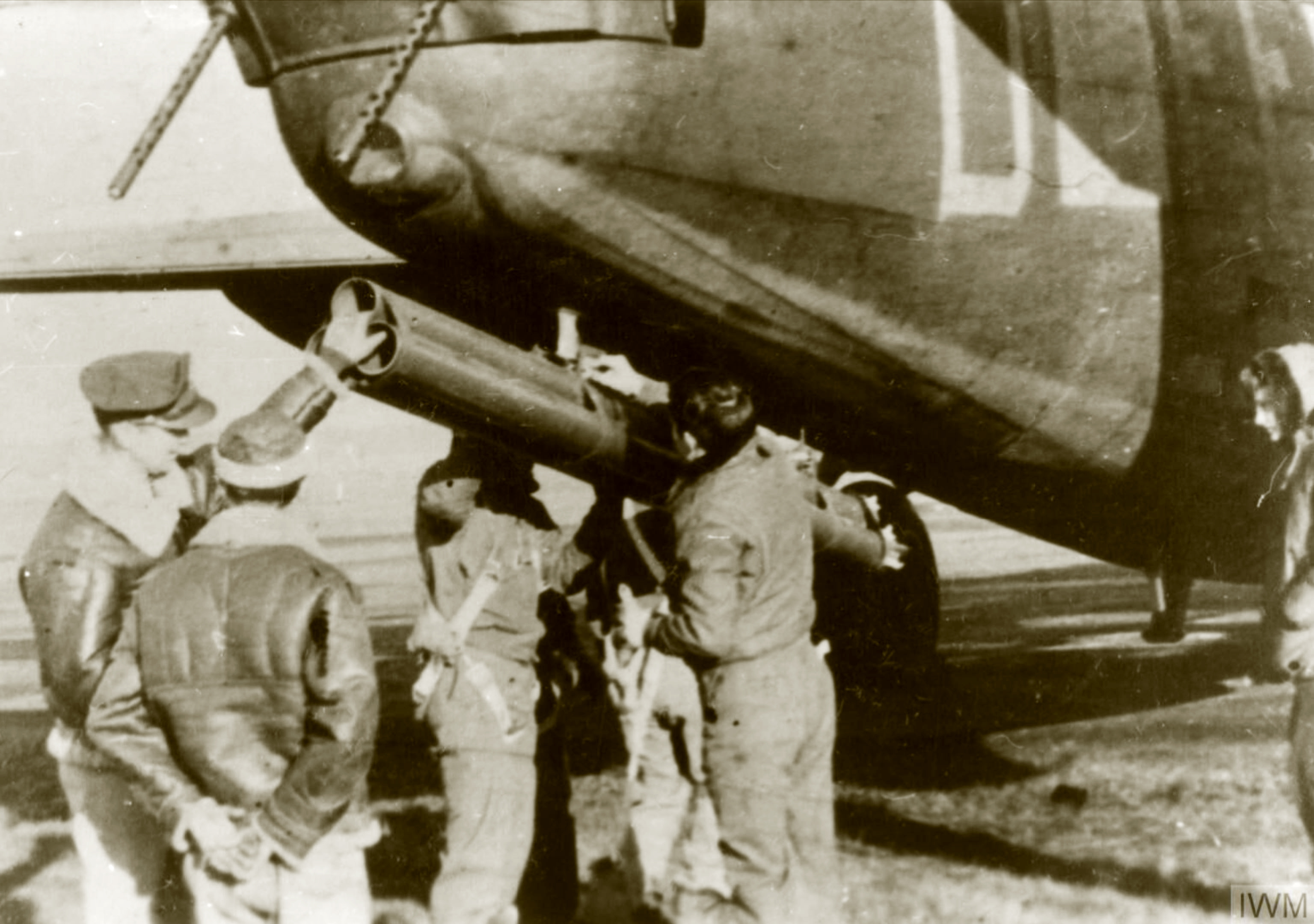 42-50290 B-24H Liberator 8AF 389BG565BS EED in flight launches a rocket from beneath its tail FRE1552
