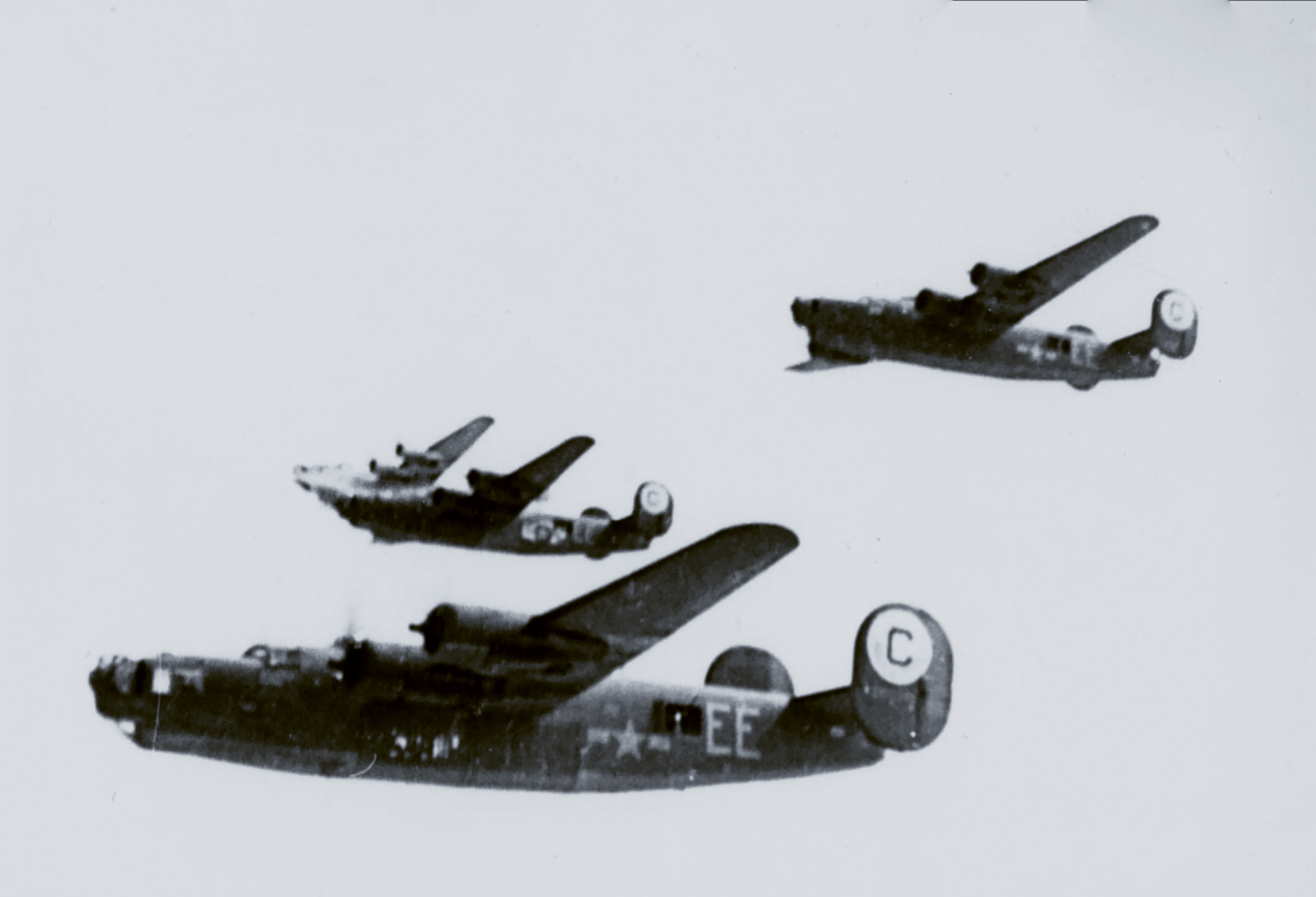 Consolidated B-24 Liberators 8AF 389BG565BS EE fly in formation during a mission FRE14246