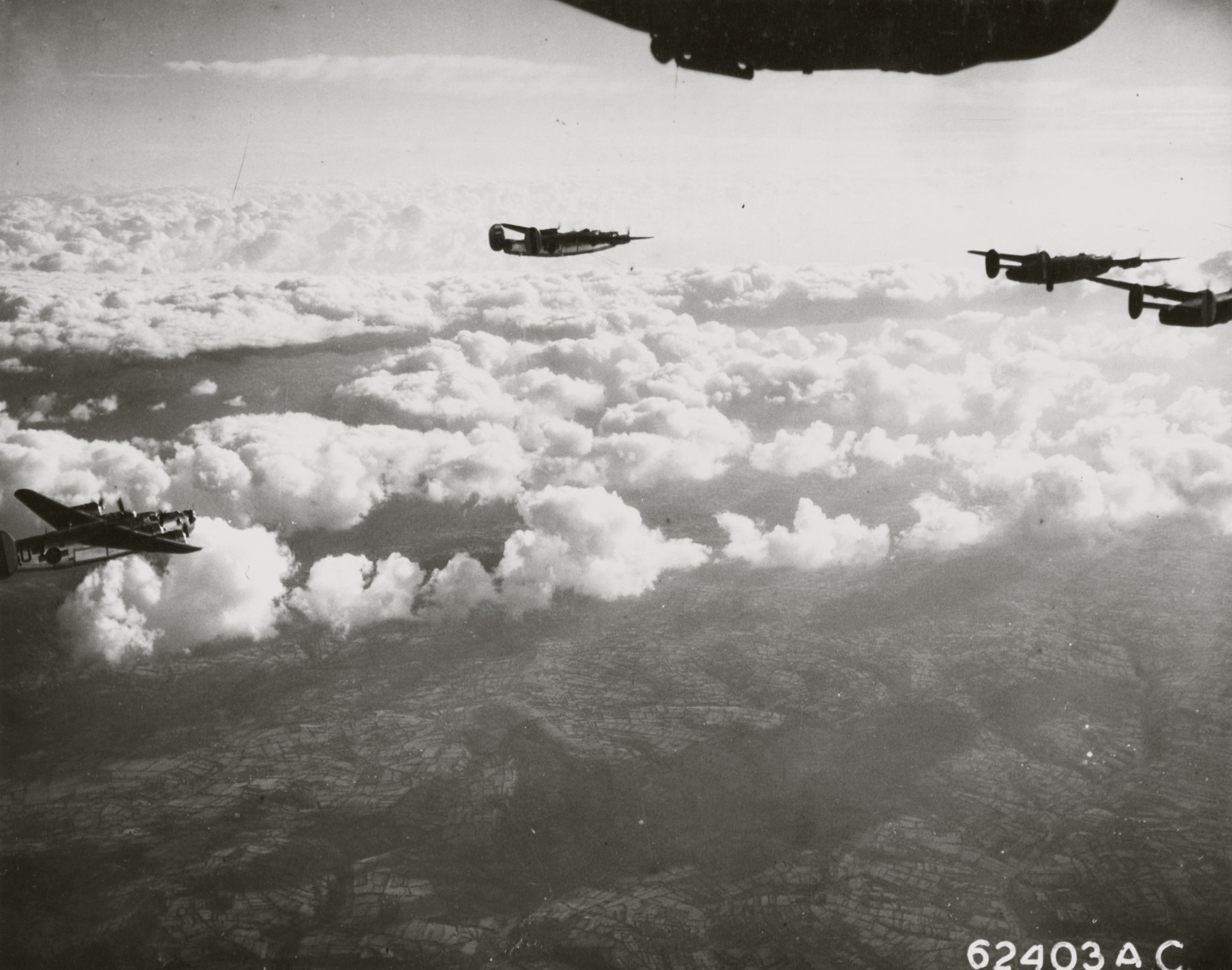 Consolidated B-24 Liberators 8AF 392BG enroute to the drop zone 24th Nov 1944 01