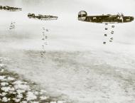 Asisbiz 41-29144 B-24H Liberator 8AF 446BG704BS FLP Ronnie over the Rheine Marshalling Yards 9th Mar 1945 01