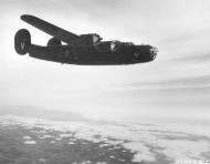 Asisbiz 41-23813 B-24D Liberator 8AF 44BG68BS V Victory Ship during a mission over occupied Europe 1943 NA2804