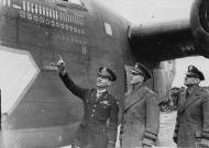 Asisbiz Aircrew USAAF 44BG Col Johnson shows Gen Devers and Gen Eaker 41 23813 B-24D n Ploesti miss 22nd Nov 1943 FRE3447