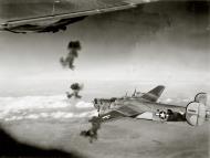 Asisbiz 44-49043 B-24L Liberator 15AF 451BG727BS 5 and 65 Short Stuff flying through flak on a mission 01