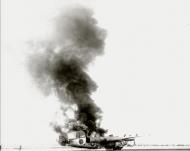 Asisbiz 44-49458 B-24L Liberator 15AF 451BG724BS 27 on fire 01