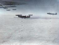 Asisbiz Consolidated B-24 Liberators 15AF 451BG over their the Railyards at Regensburg Germany 13th Mar 1945 01