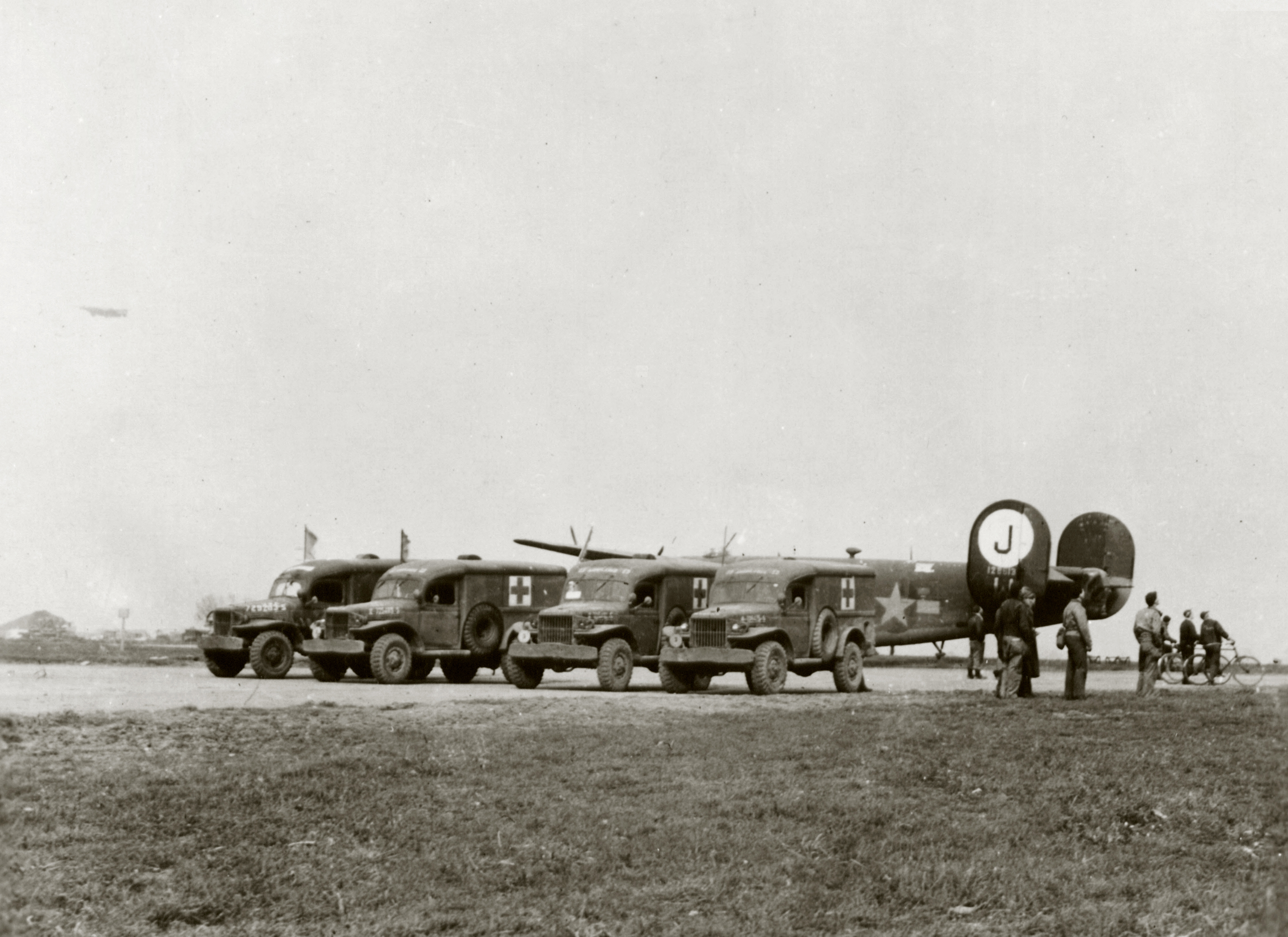 41-28613 B-24H Liberator 8AF 453BG733BS F8W Maid of Fury with Dodge WC 54 ambulances England 16th Mar 1944 01