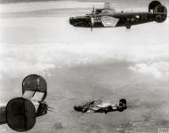 Asisbiz 41-28904 B-24H Liberator 15AF 465BG781BS with 42 52337 460BG761BS Cuddles on fire after 23rd Jul 1944 FRE8751