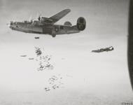 Asisbiz Consolidated B-24 Liberators 15AF 460BG release bombs over Neuberg Austria 26th Mar 1945 01