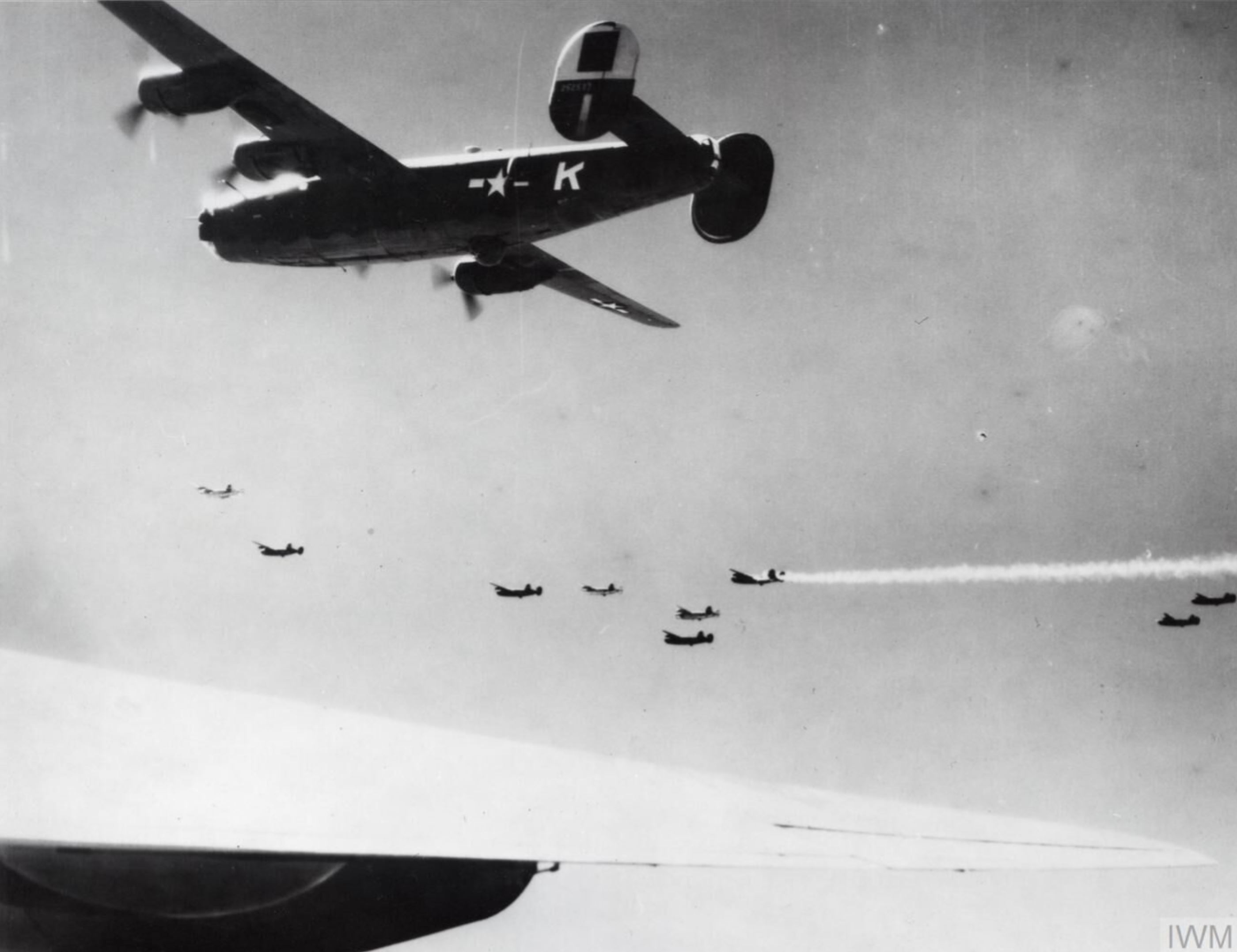 42-52537 B-24H Liberator 15AF 464BG778BS K Ruthie The Raider during a mission with one ac on fire FRE14015