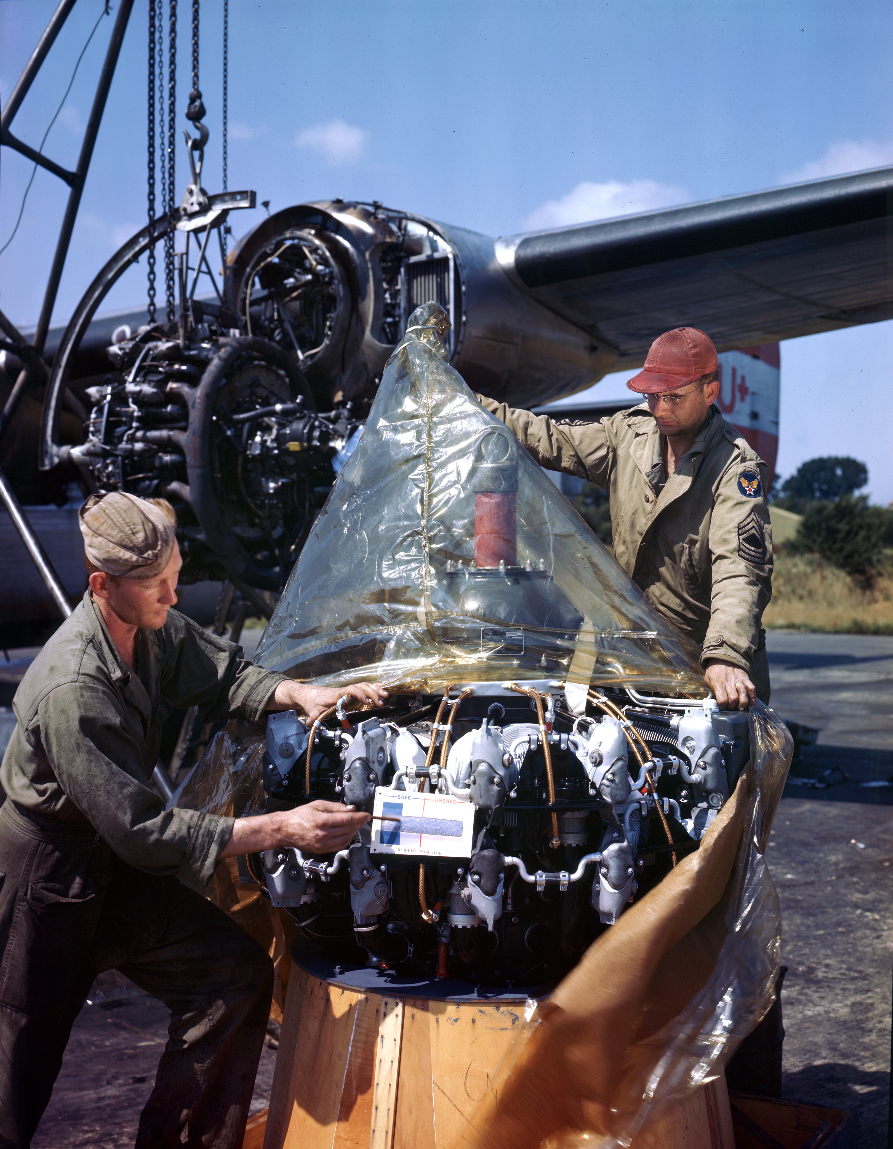 B 24H Liberator 8AF 466BG coded U+ being repaired after flak damage to its engine England 1944 01