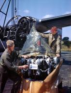 Asisbiz B-24H Liberator 8AF 466BG coded U+ being repaired after flak damage to its engine England 1944 01