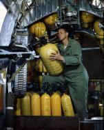 Asisbiz Ordanance guy checks the oxygen levels before flight in a B-24 Liberator England 1944 01
