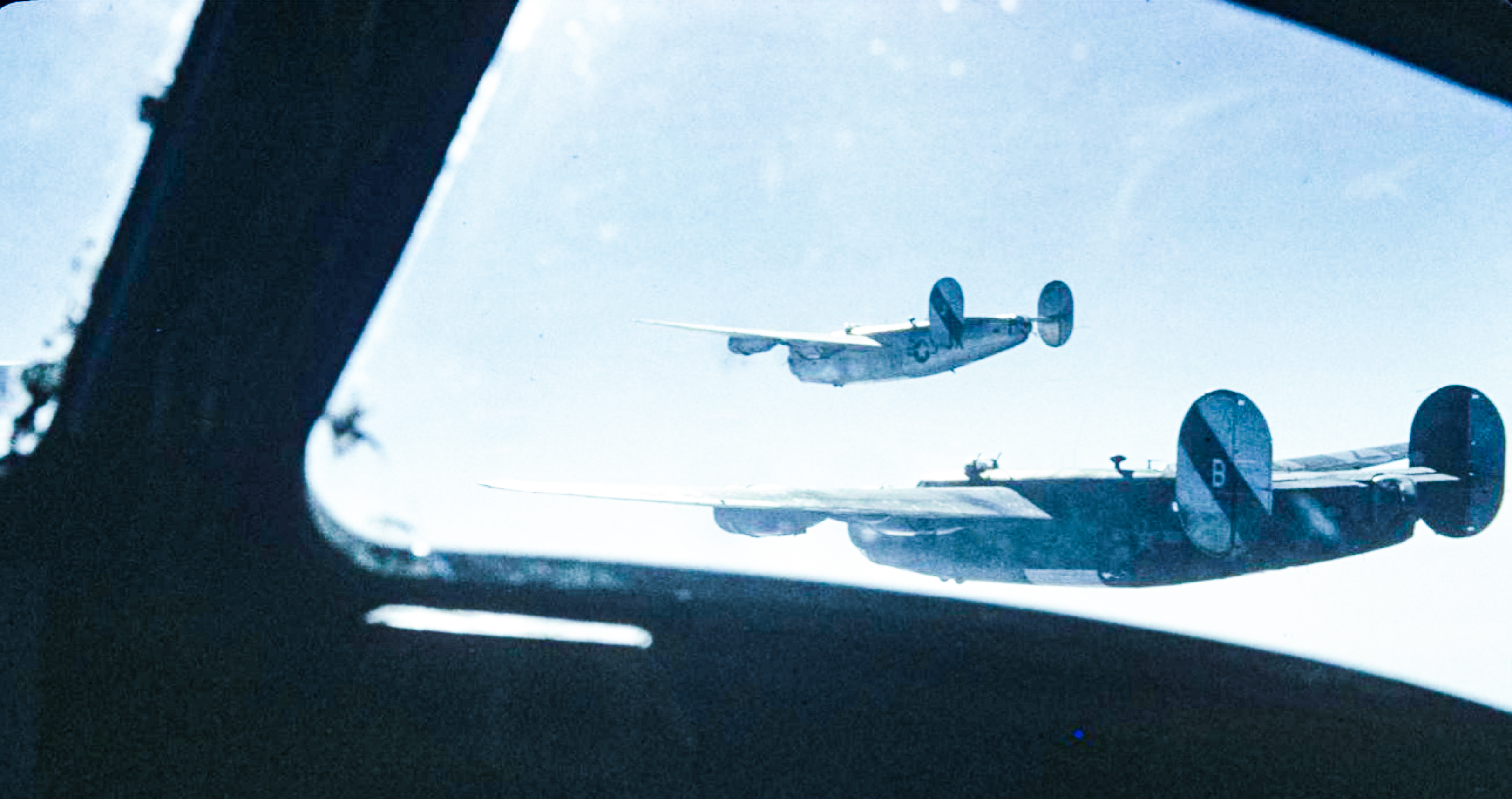 Consolidated B-24J Liberators 8AF 491BG854BS 6XB and 6XJ fly together during a mission FRE6883