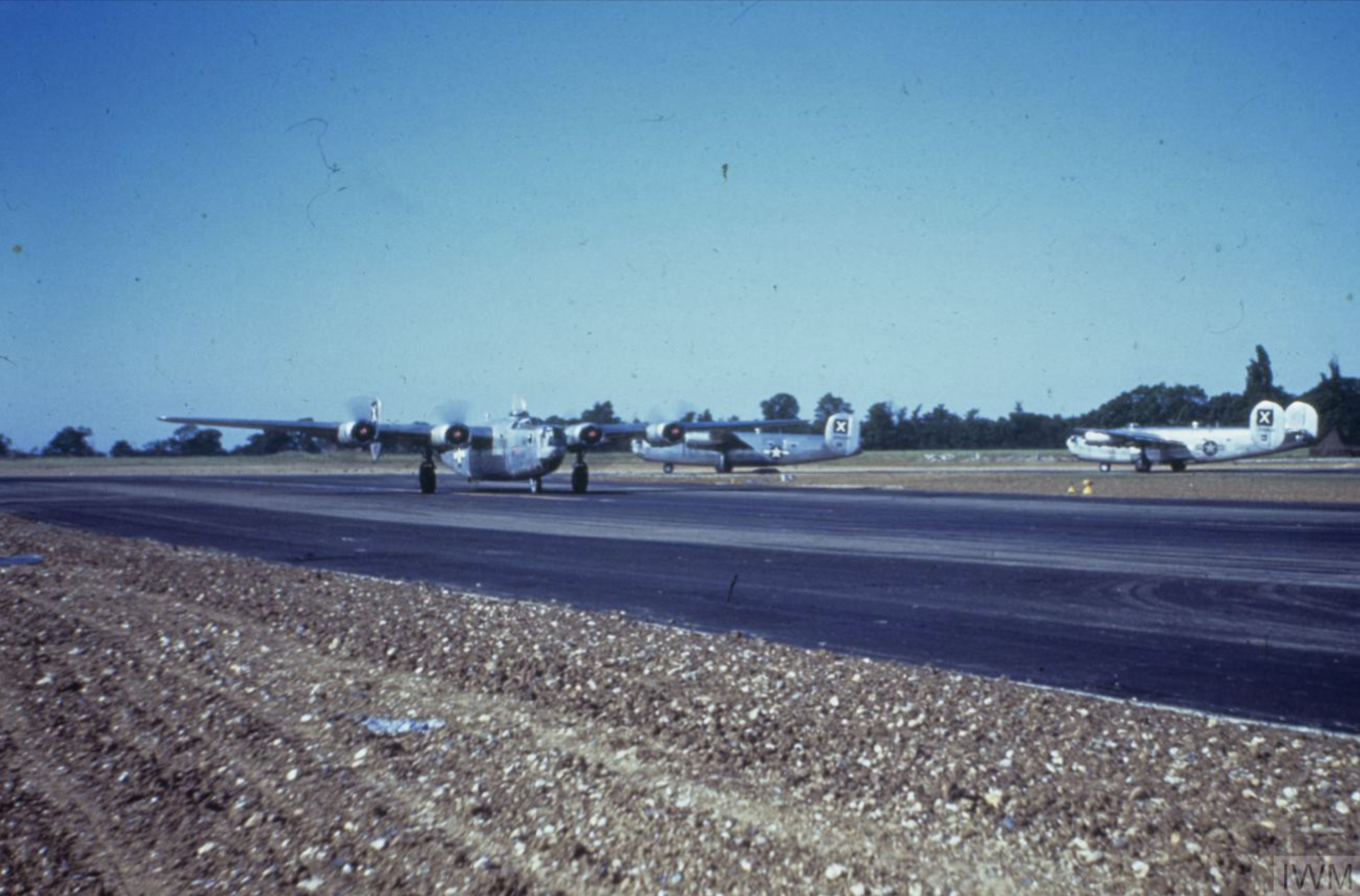 Consolidated B-24 Liberators of the 493rd Bomb Group line up for take off FRE6906