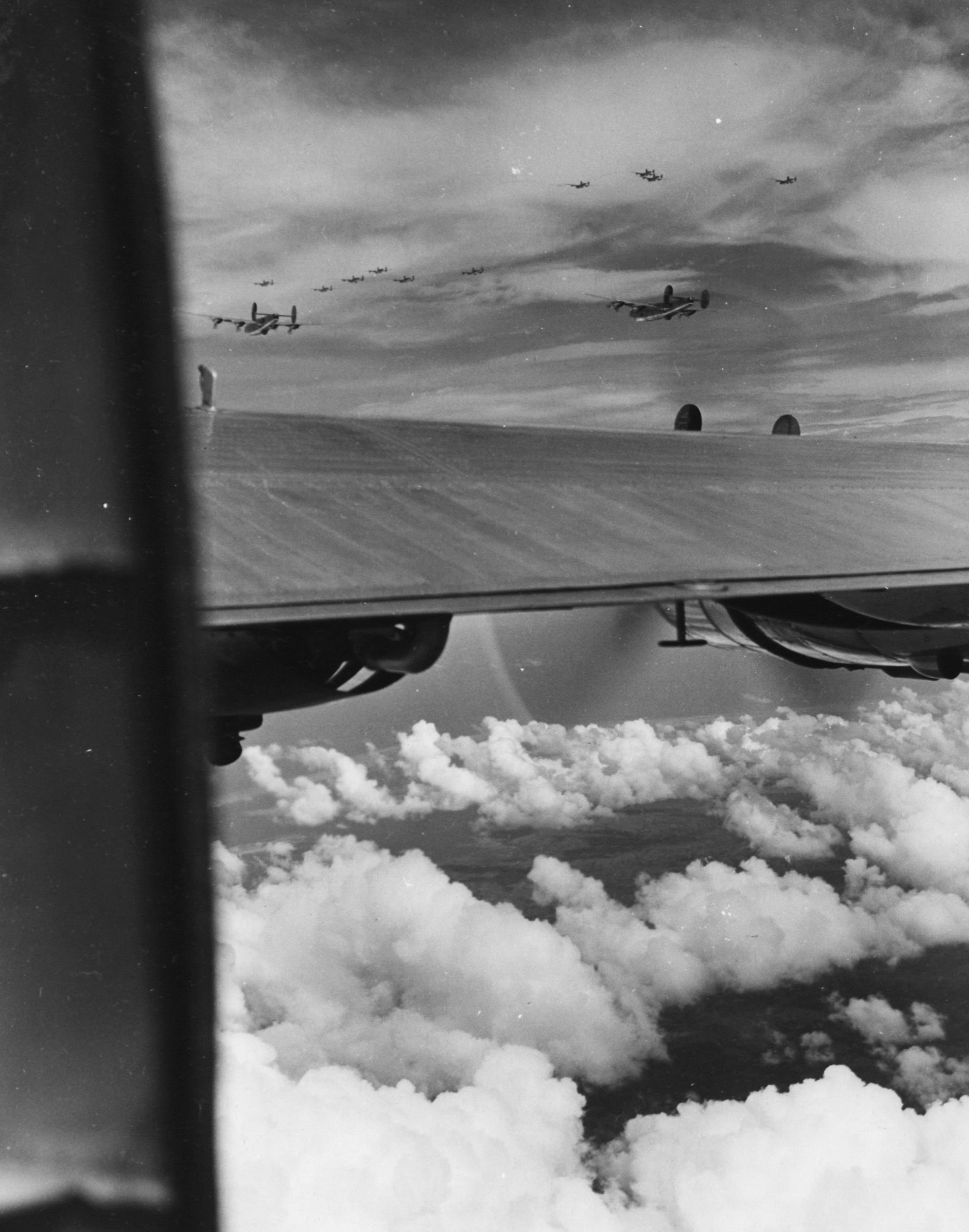 Consolidated B-24J Liberators 7AF 494BG866BS 867BS enroute to bomb enemy installations Cebu Philippines 6th Dec 1944 01