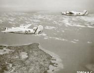 Asisbiz 44-40561 B-24J Liberator 7AF 494BG865BS 561 in formation with 056 over Mindanao Philippines 01