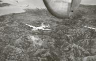 Asisbiz 44-40705 B-24J Liberator 7AF 494BG865BS 705 The Sniffin Griffin in formation over Cebu Philippines 01