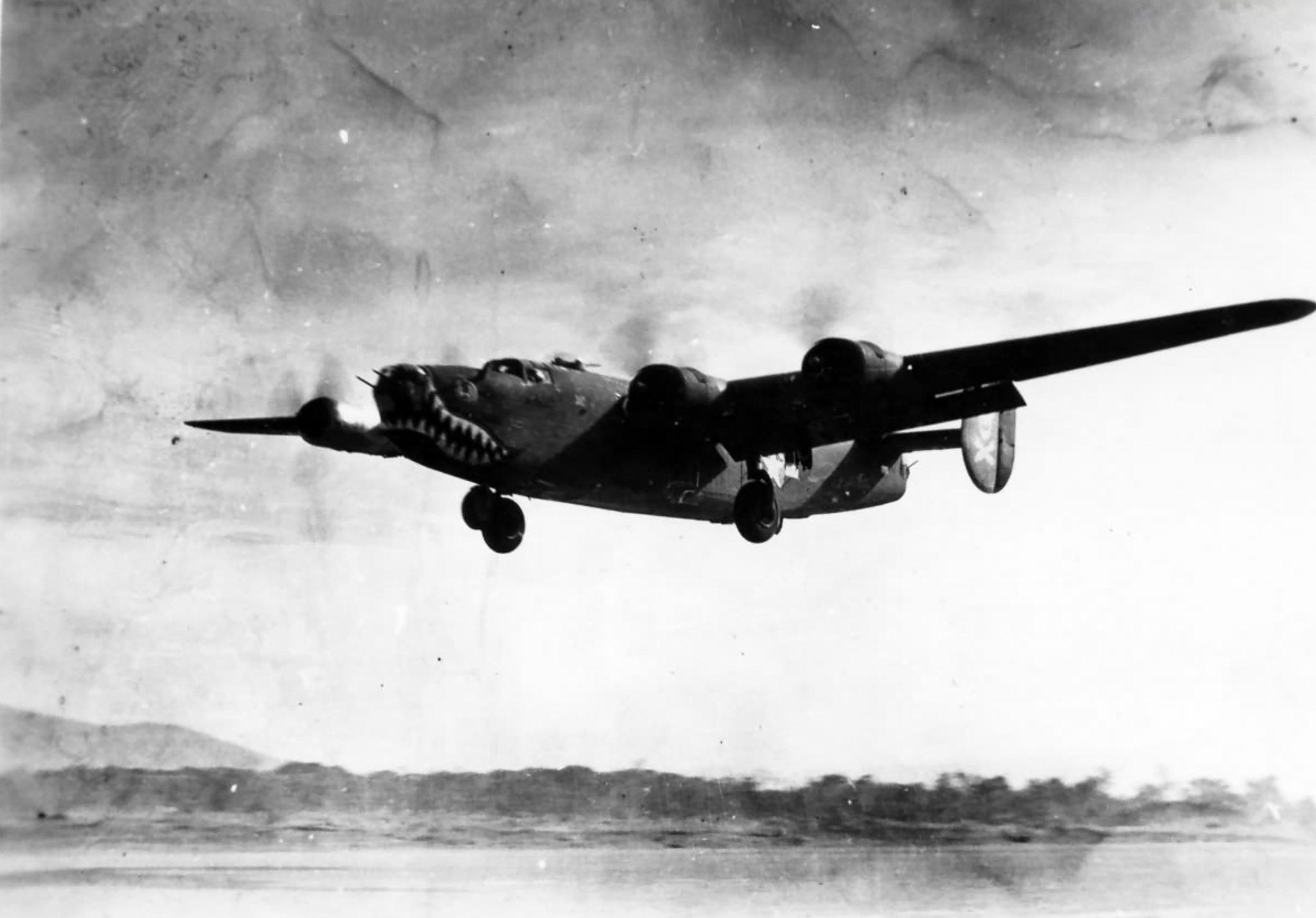 Consolidated B-24J Liberator 5AF 90BG321BS takes off from New Guinea 01