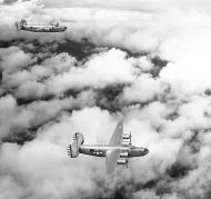 Asisbiz 44-48982 B-24J Liberator 5AF 90BG321BS during a mission 01