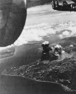 Asisbiz Consolidated B 24 Liberator 5AF 90BG over Borneo after hitting the refinery 2nd Jan 1945 01
