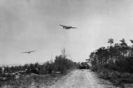 Asisbiz Consolidated B-24 Liberators 8AF 93BG fly low over British tank column in the Rhine to drop supplies 24th Mar 1945 FRE14250