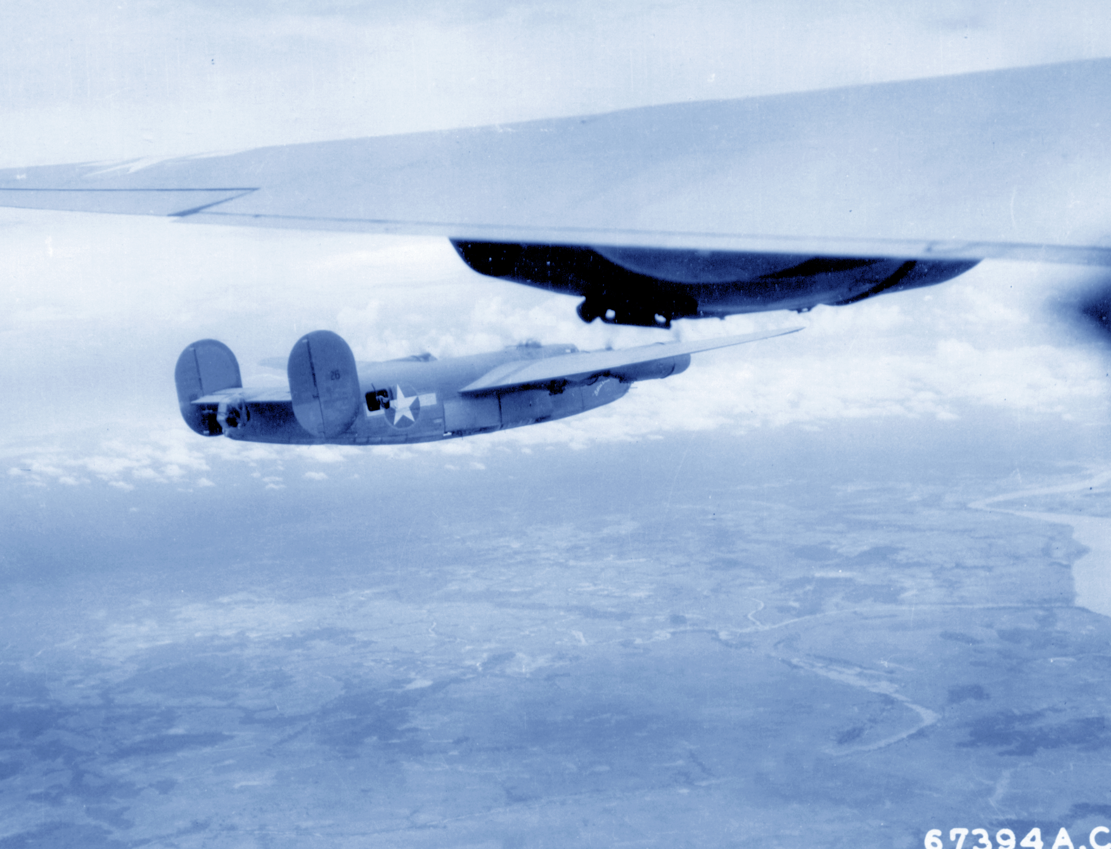 41-23921 B-24D Liberator 10AF 7BG493BS Sittin' Bull hits dockside warehouses in Rangoon 1943 NA147