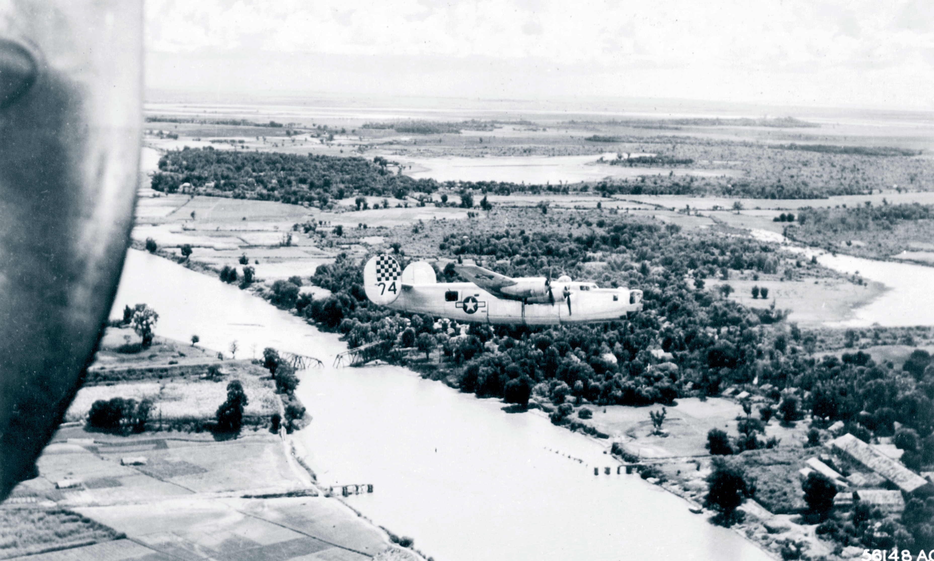 B 24 Liberator 10AF 7BG436BS 74 passes over the demolished Bilin railway Bridge Burma 13th Dec 1944 NA371