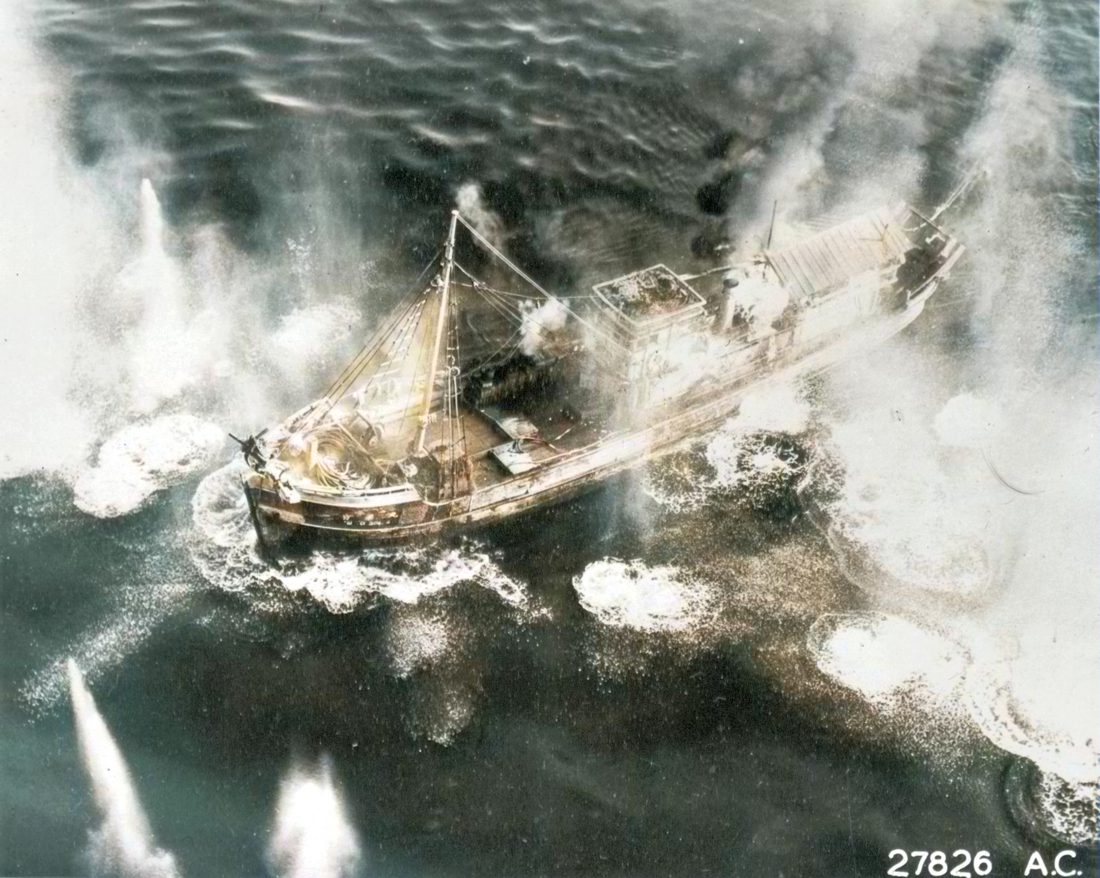 Target 10AF aircraft blanketing a Jap freighter with direct hits in the Andaman Sea at Mergui Burma NA578