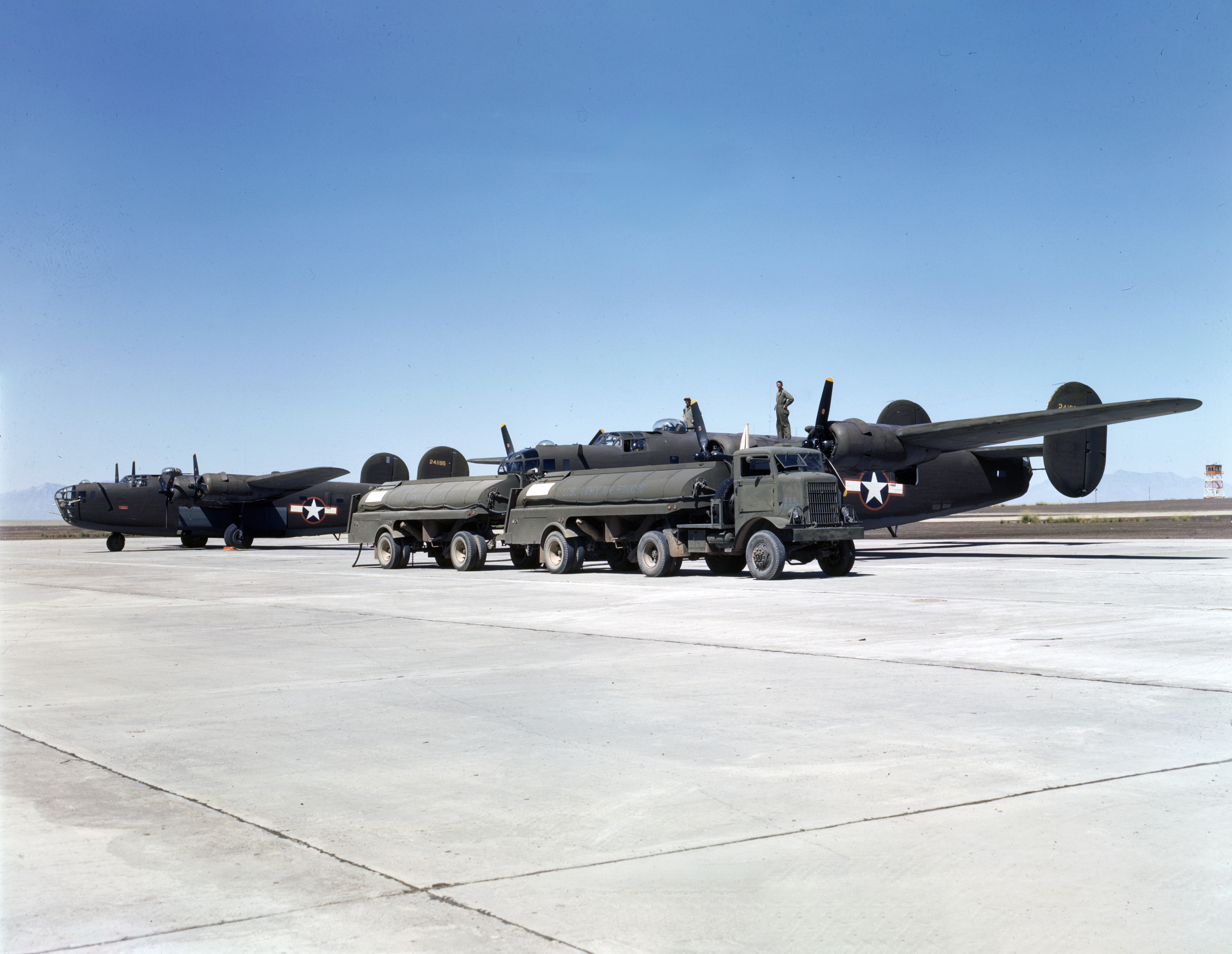 WWII color photo of USAAF 42-41195 Consolidated B-24D Liberator being refueled in the USA 1943 01