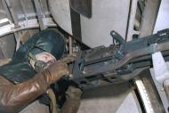 Asisbiz Crew air gunner defensive positions within the Consolidated B-24 Liberator 376BG waist gunner using armor 1944 01