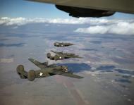 Asisbiz WWII color photo of USAAF 41-24102 B-24D Liberator during a training flight over America 03