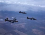 Asisbiz WWII color photo of USAAF 42-63764 B-24D Liberator during a training flight over America 01