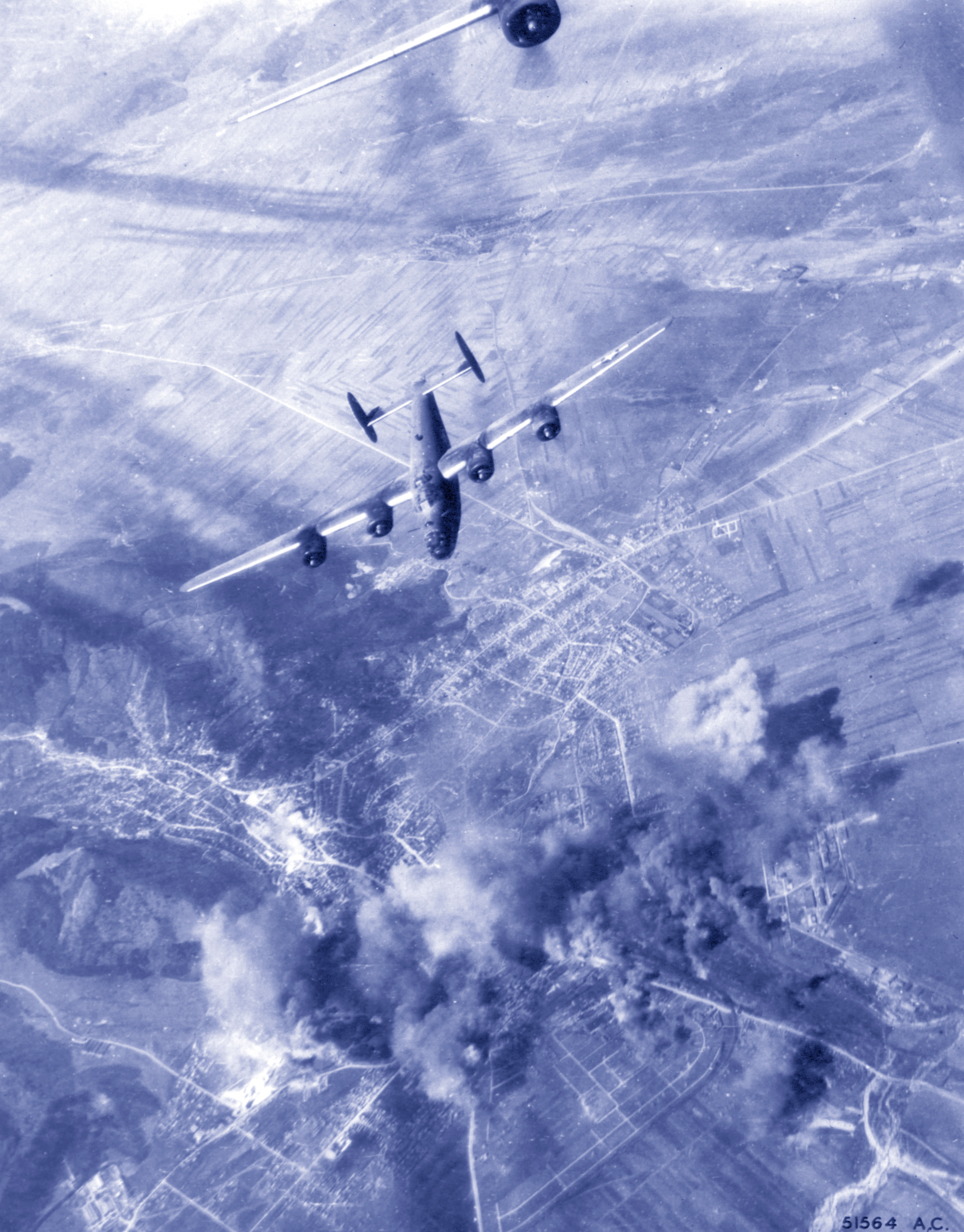 15AF Consolidated B-24 Liberators bomb the railroad yards at Brasov Rumania 16th April 1944 NA975