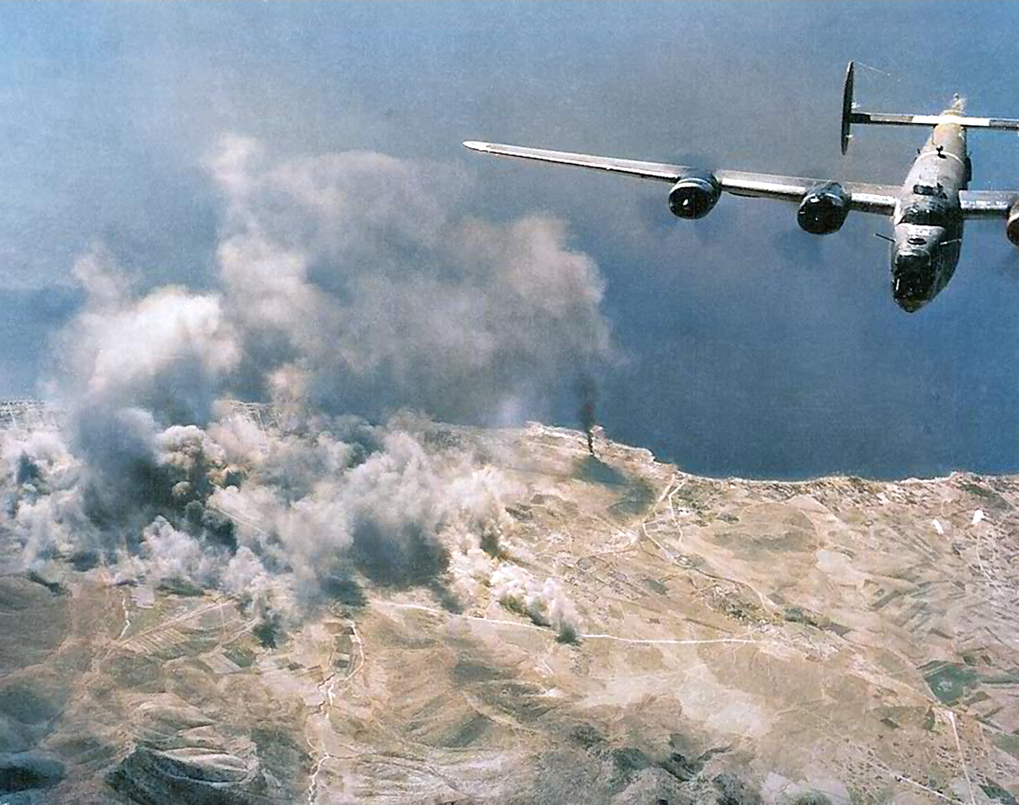 Target 15th Air Force 55BW B-24 Liberator over a enemy coastal town ASC1