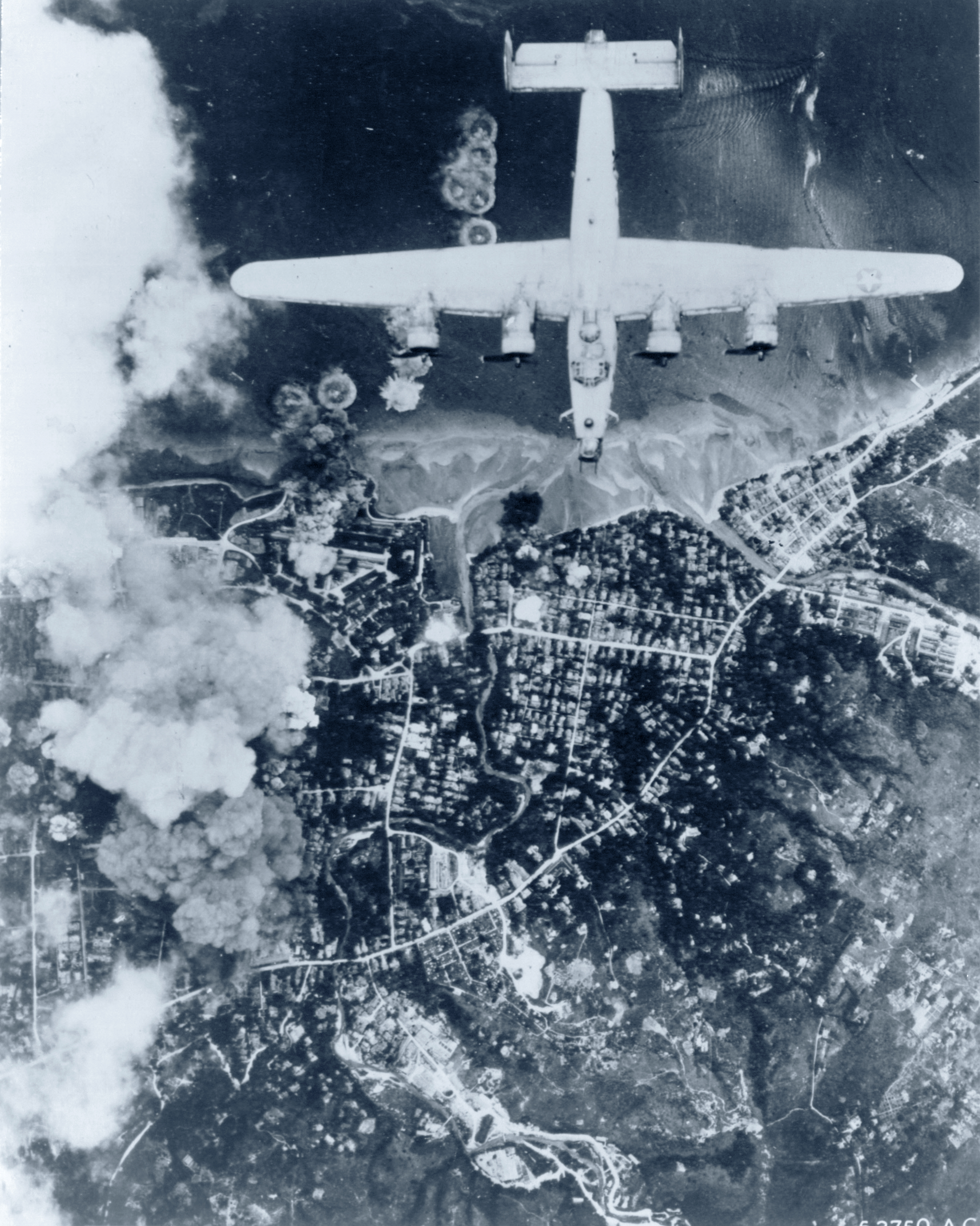 Far Eastern Air Force B-24 Liberators bomb town of Ambon on the Island of Ceram Sep 1944 NA418