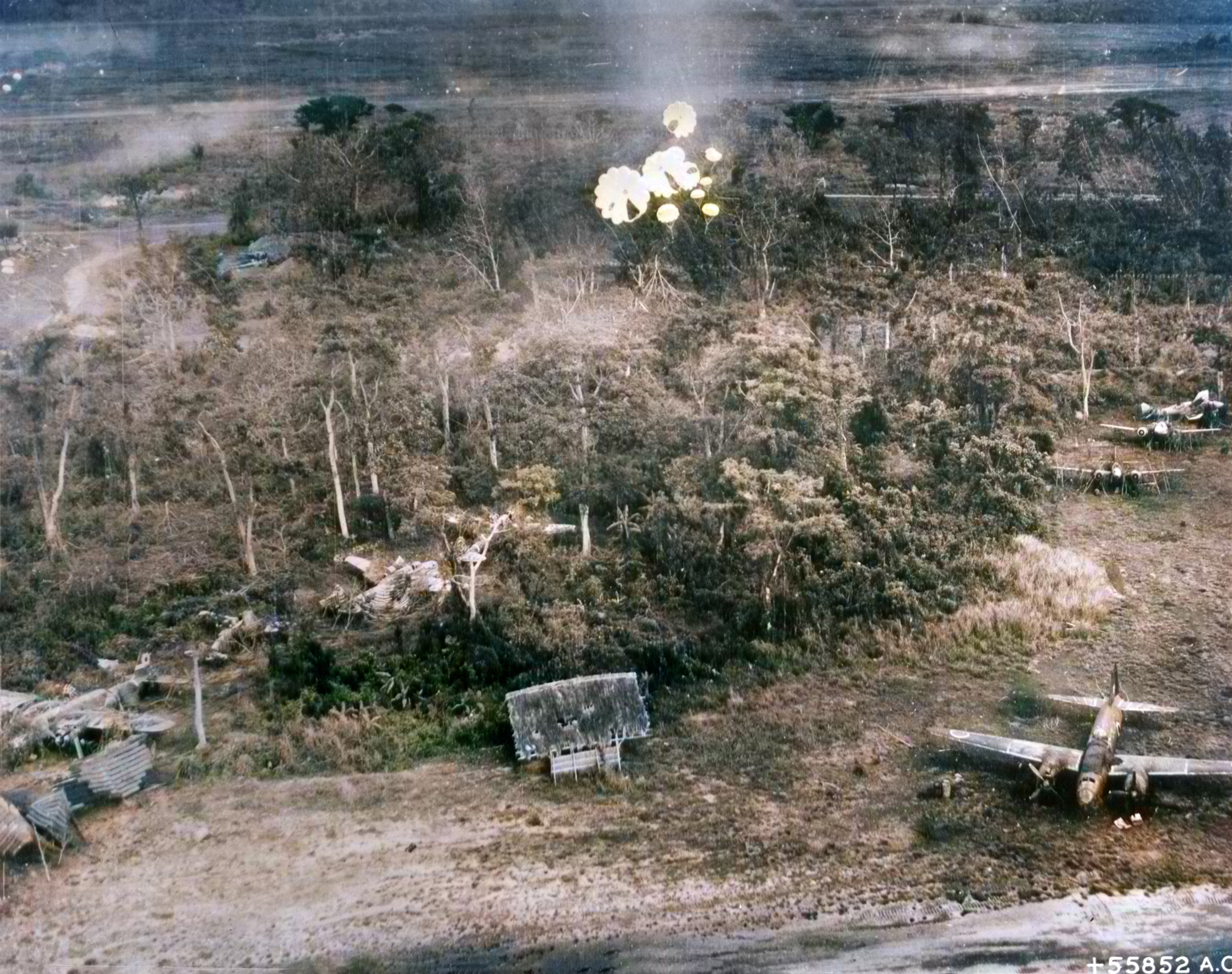 Japanese held Clark Field on Luzon being attacked by parachute bombs during a combination raid of three US air forces N01