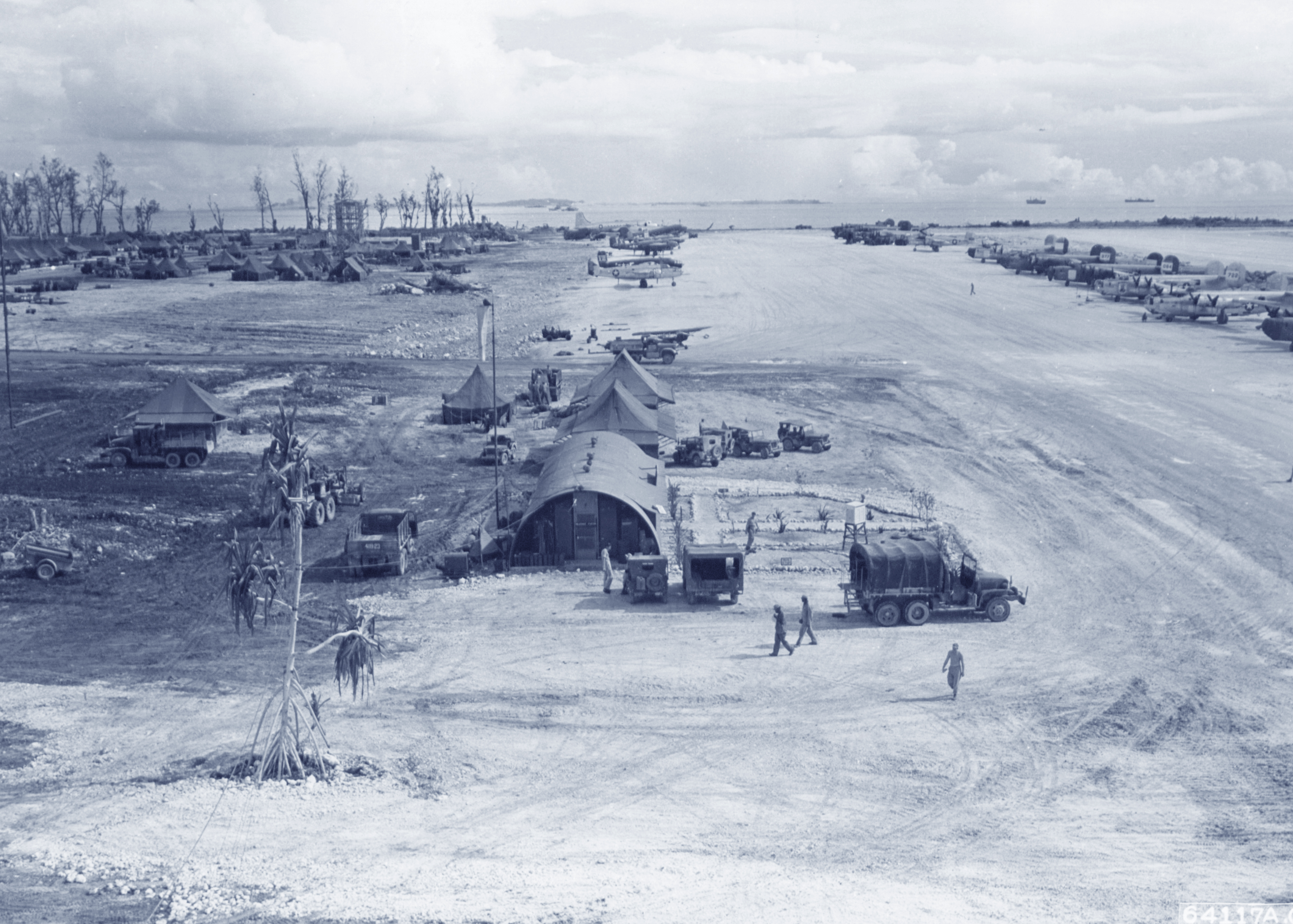 USAAF airbase at Angaur Island Caroline Islands with 5AF 22BG B-24 Liberators lined up on the strip 9th Dec 1944 NA115